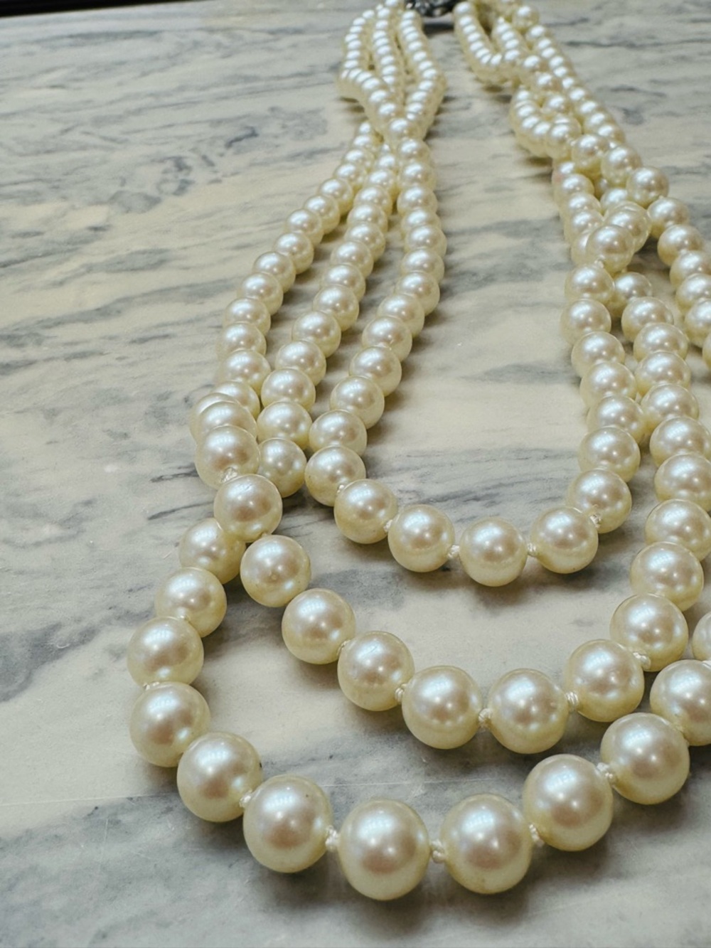 stunting vintage Japanese simulated pearl necklace featuring triple strand
